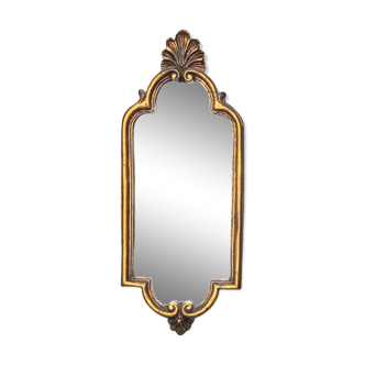 Old small wall mirror in golden resin