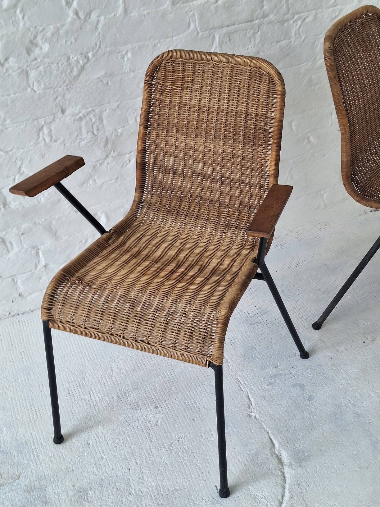 Pair of Swiss stackable rattan and iron dining elbow chairs, G Legler 1960s
