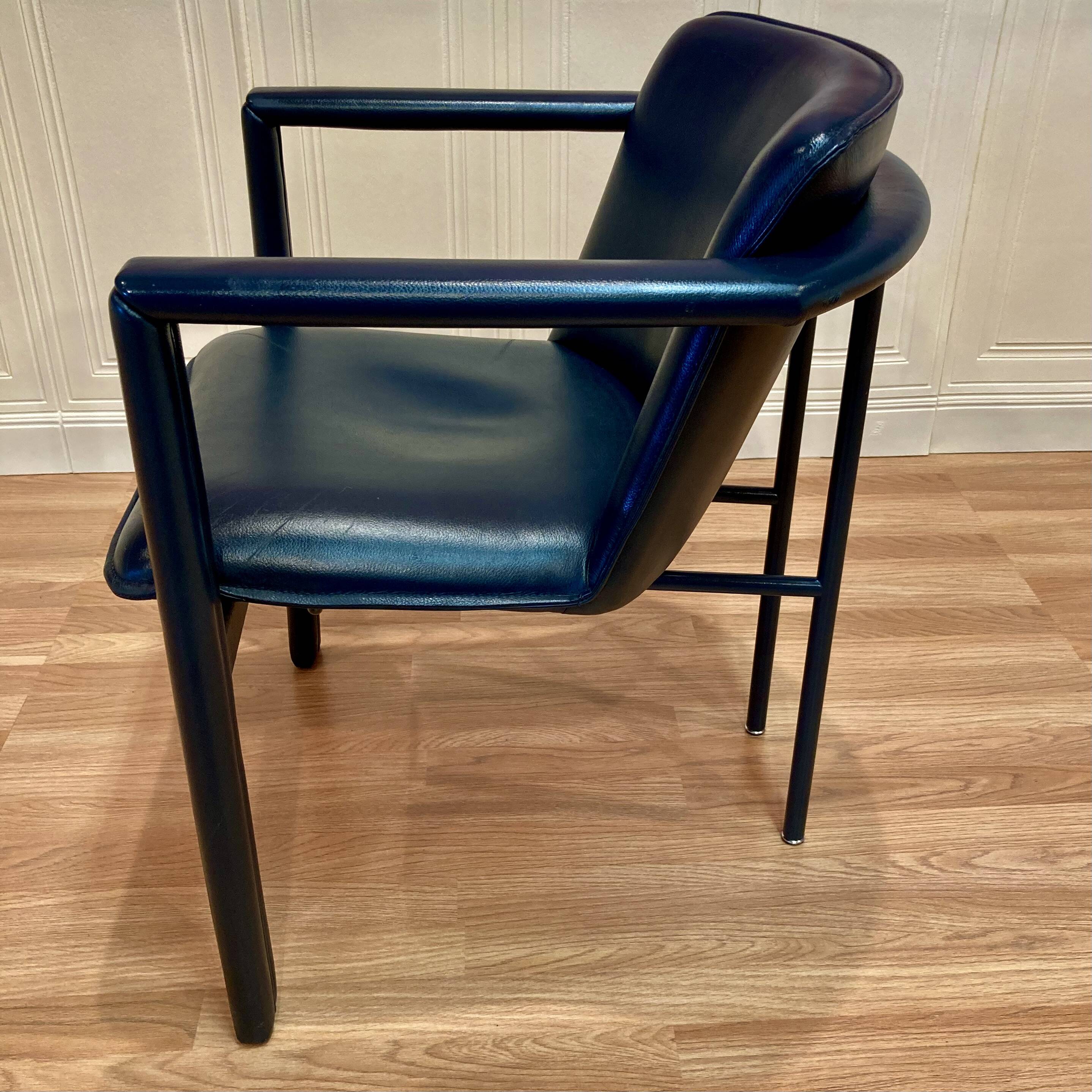 Set of 3 designer leather and metal armchairs.