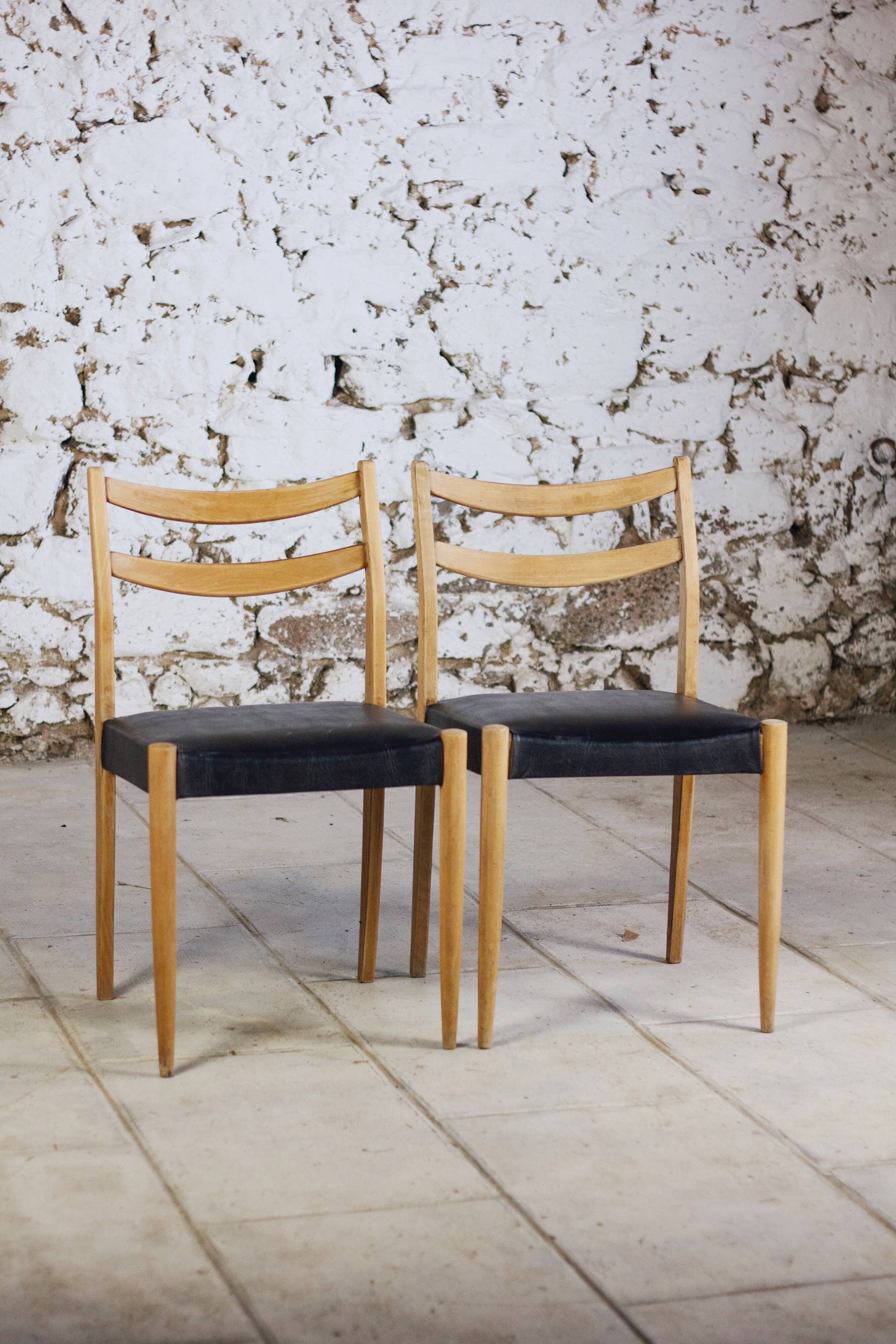 Pair of Scandinavian chairs in teak and faux leather, 1960.