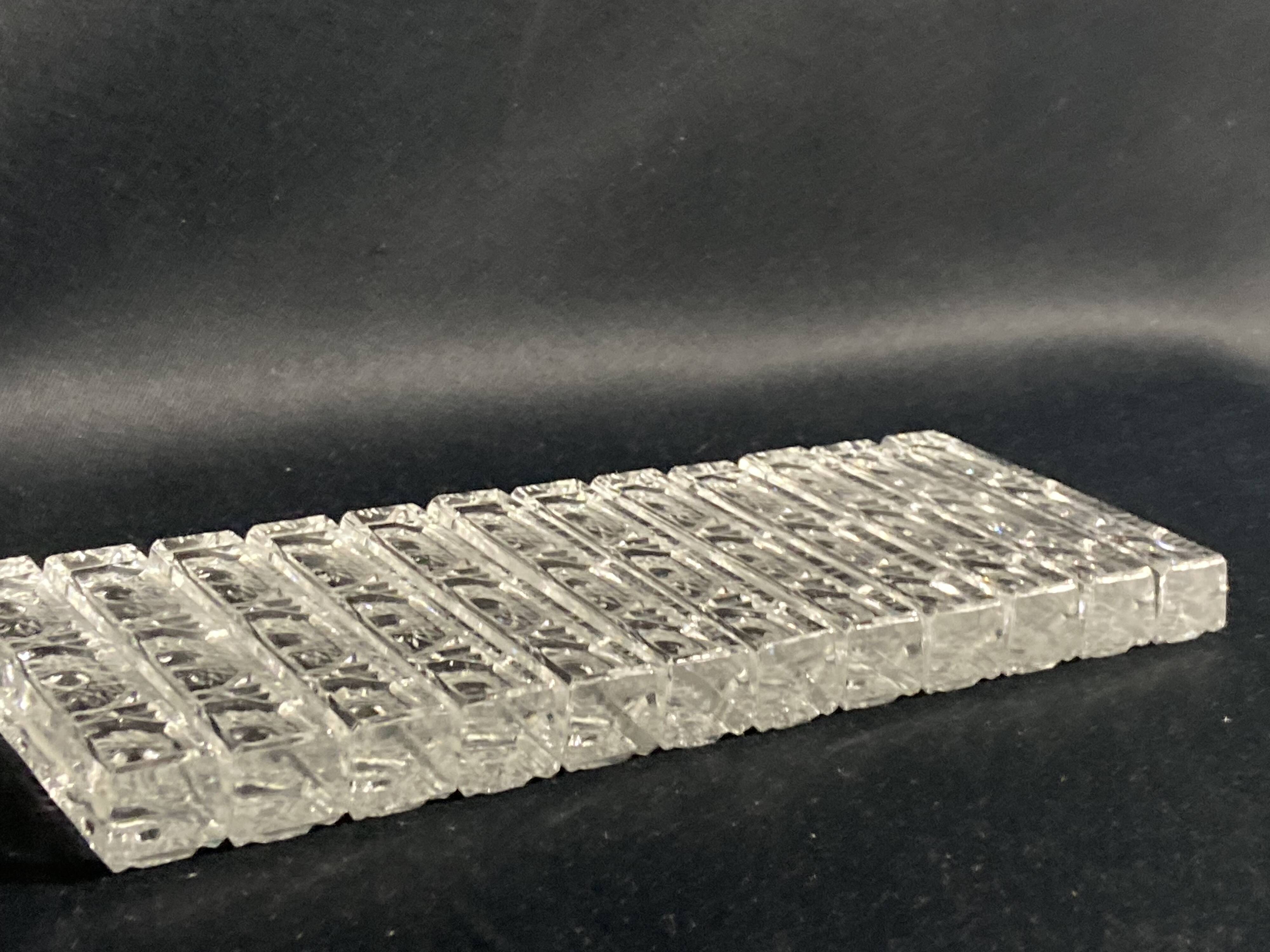 Set of 12 molded glass or crystal knife rests with diamond point decor