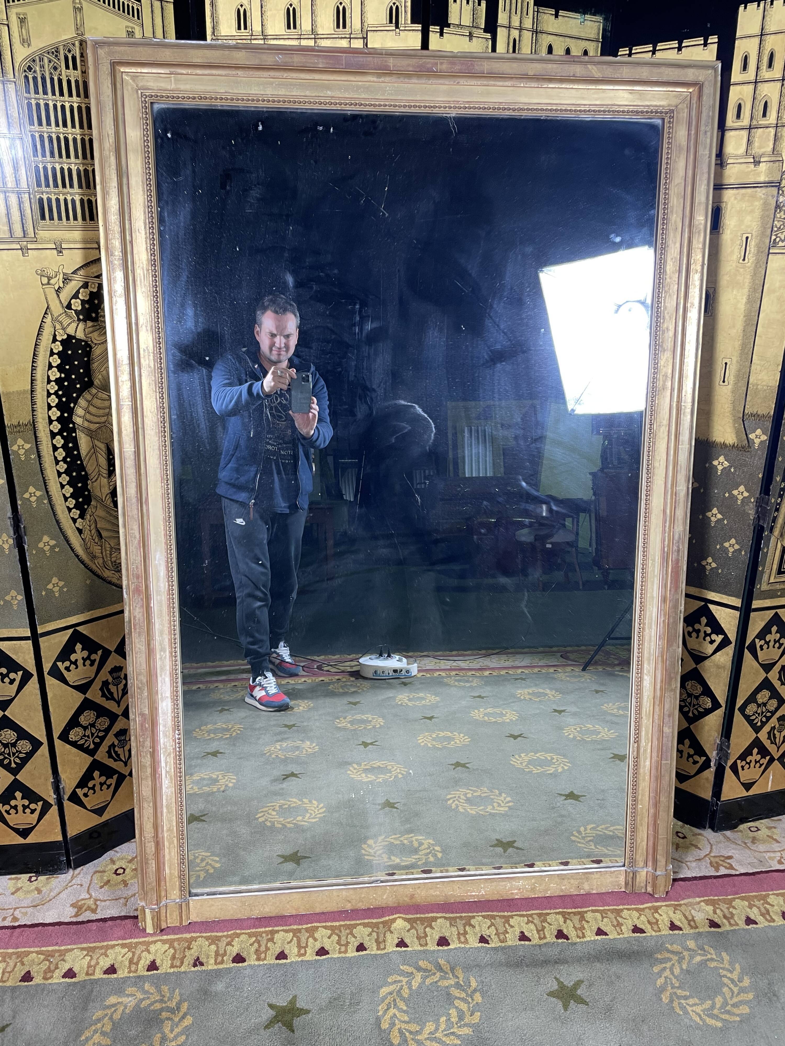 Louis XVI style mirror with 19th gold leaf