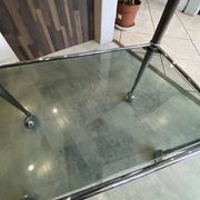 Serving dessert trolley with 2 smoked glass shelves and metal structure.