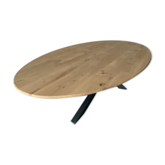 Oval table in solid oak refined edges with central foot in black metal
