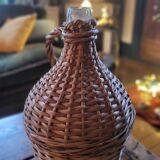 Glass demijohn encased in wicker, 1950s–1960s