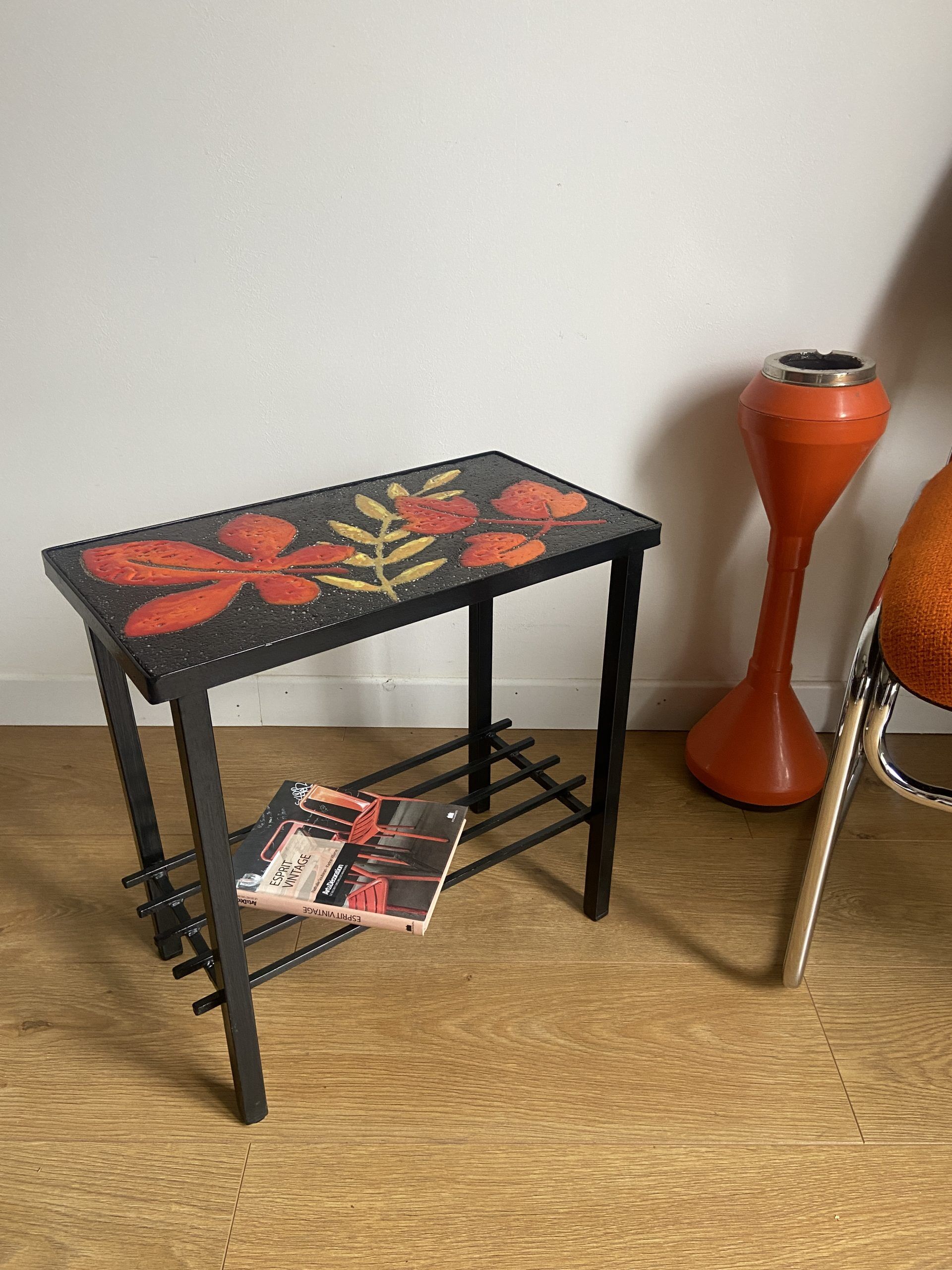 Side table or end of sofa in wrought iron and enamelled lava stone circa 1960