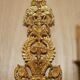 Pair of L'Originale wall sconces plated with 24-carat gold featuring four bronze candles.
