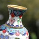 Two small vintage cloisonné enamel vases with Asian floral decoration.