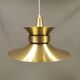 Large hanging lamp, made of brass-coloured aluminium with red and white contrast lacquer inside.