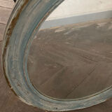 Patinated oval mirror