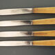 4 Ancient Stainless Table Knives and Bakelite