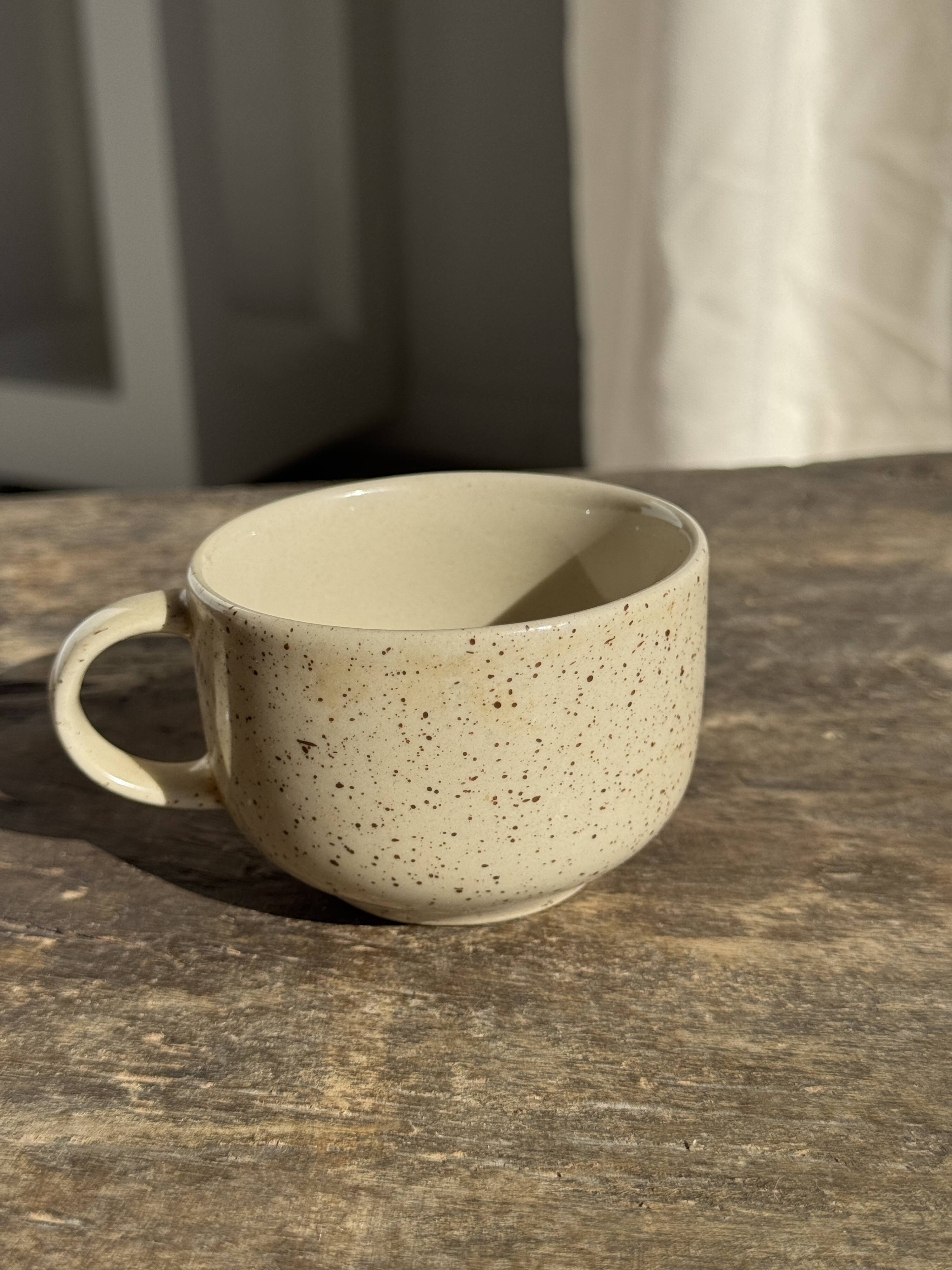 Set of 4 vintage speckled beige stoneware coffee cups.