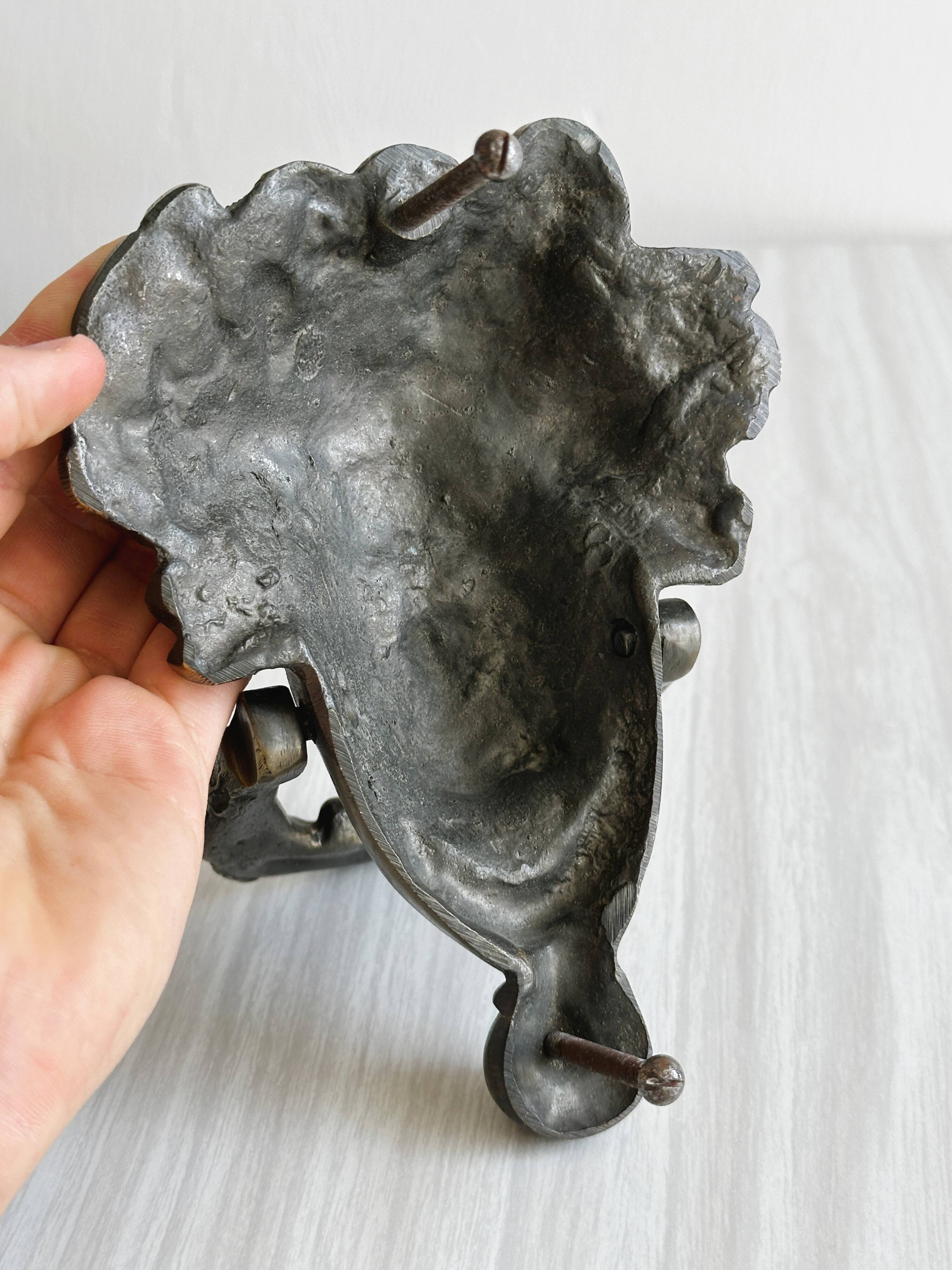 Large antique style brass metal knocker.
