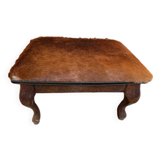 Vintage wooden and goatskin pouf