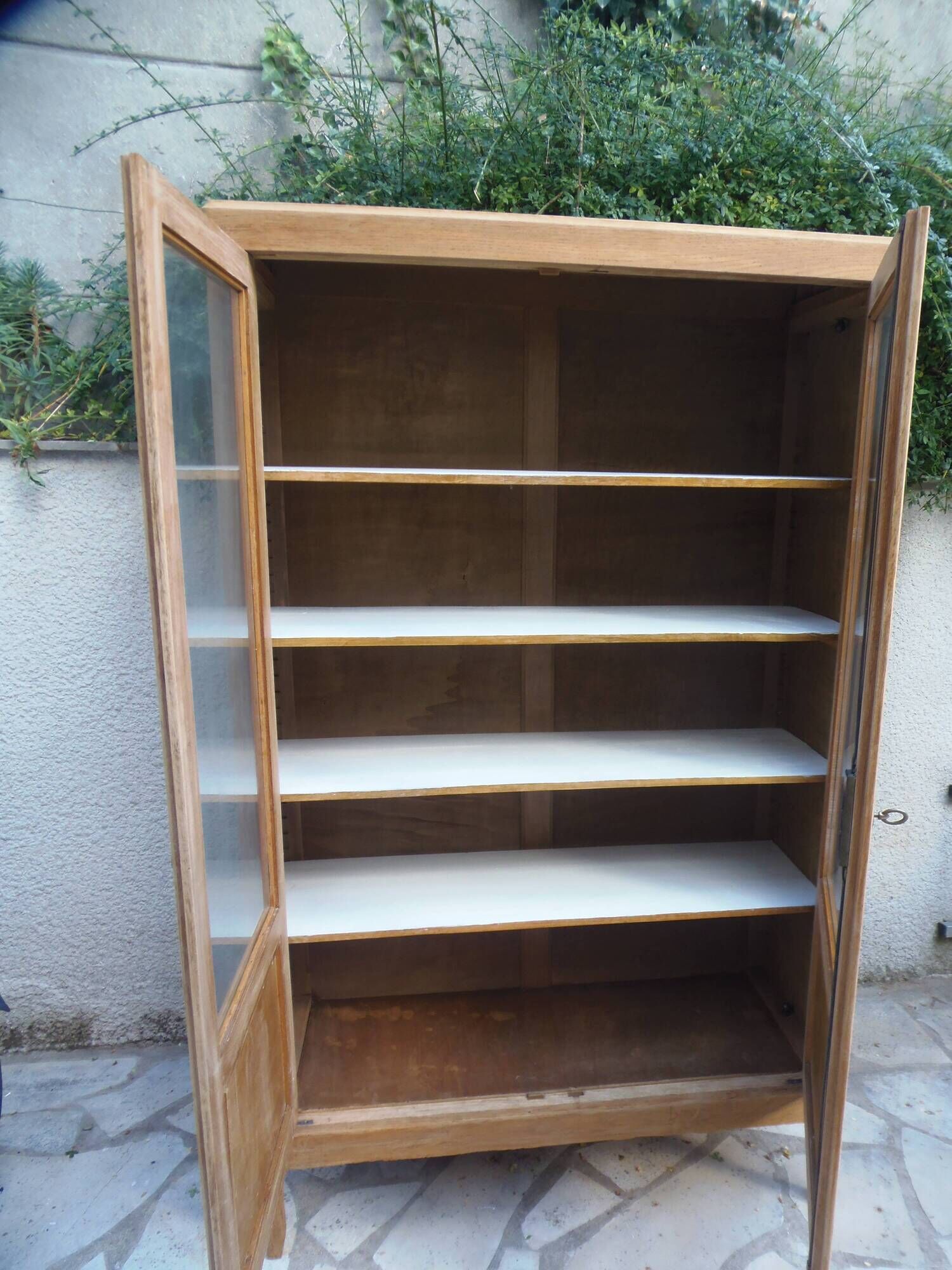 Charming vintage display cabinet from the 1950s in natural wood.