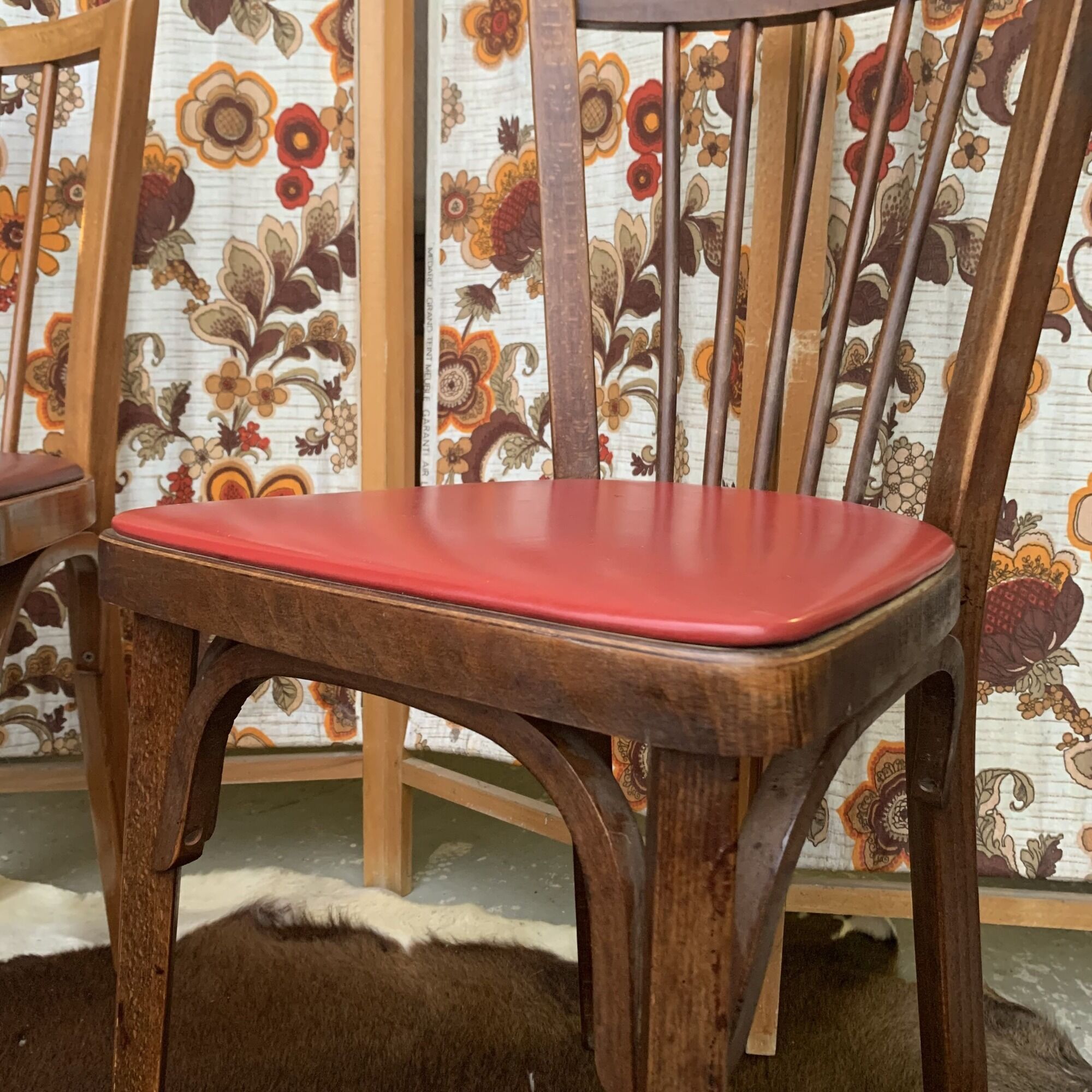 2 baumann bistro chairs sitting skai 1 red and 1 burgundy