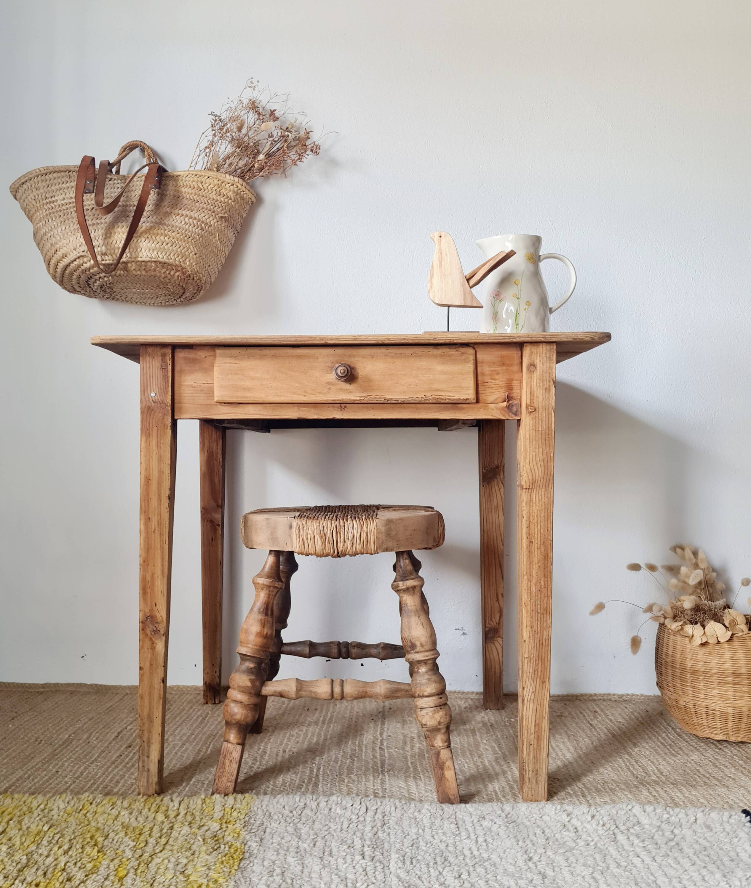 Small old farmhouse table in raw wood.