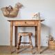 Small old farmhouse table in raw wood.