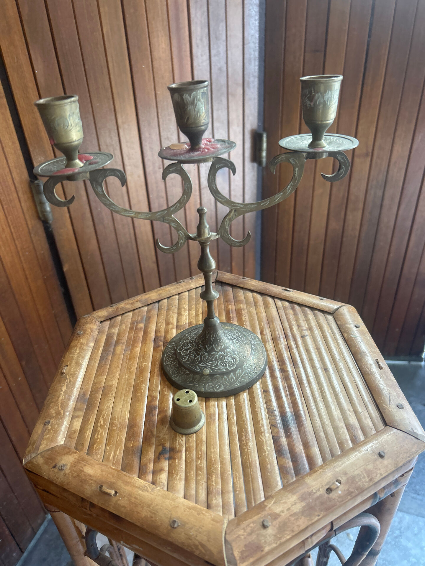 Vintage brass candelabrum engraved with three lights and a snuffer.