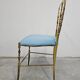 Mid-century Chiavari accent chair in solid brass with a plush seat.