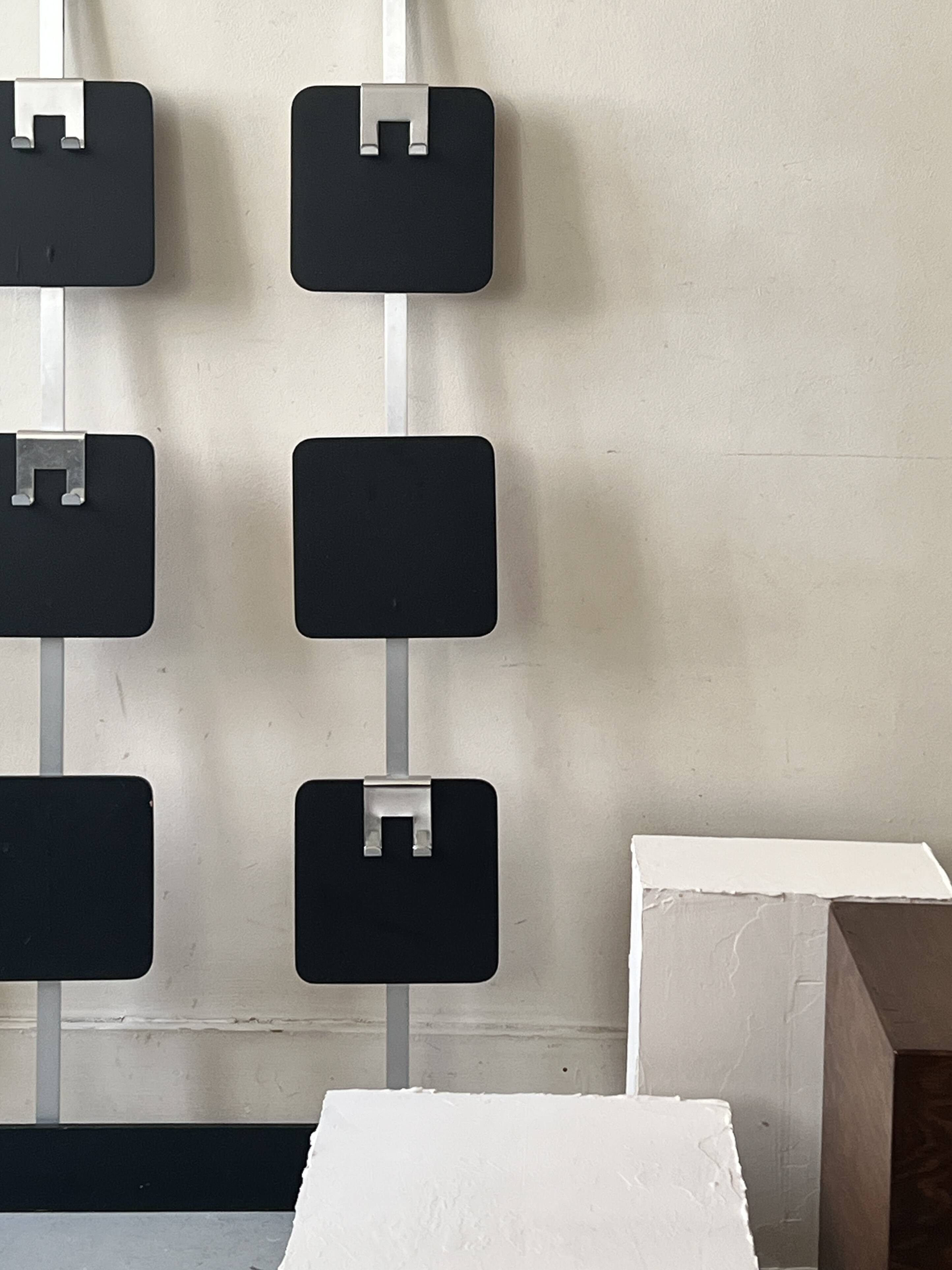 Large modernist wall coat rack in wood and metal, 1970s design.