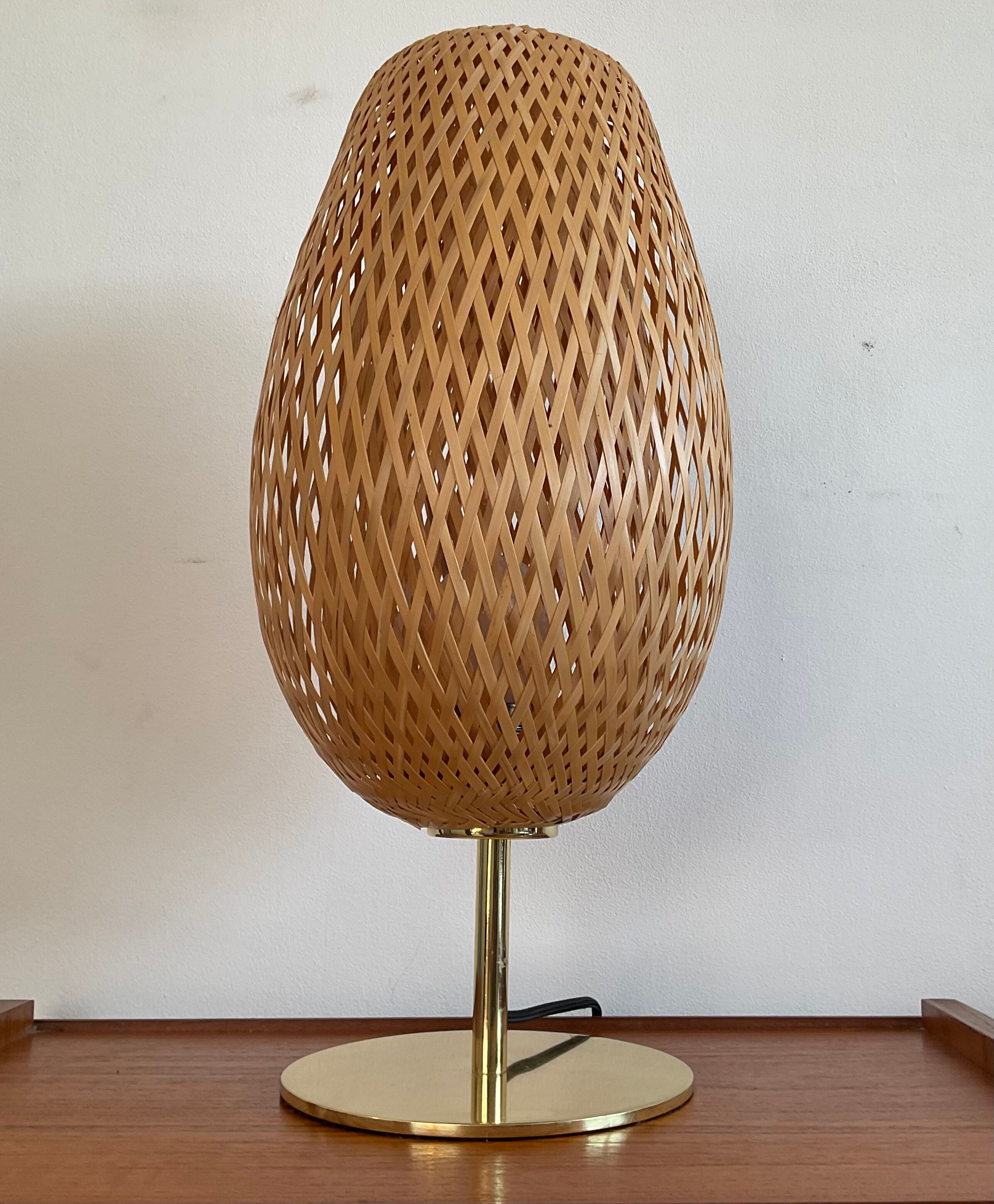 Design lamp in gold metal and wicker
