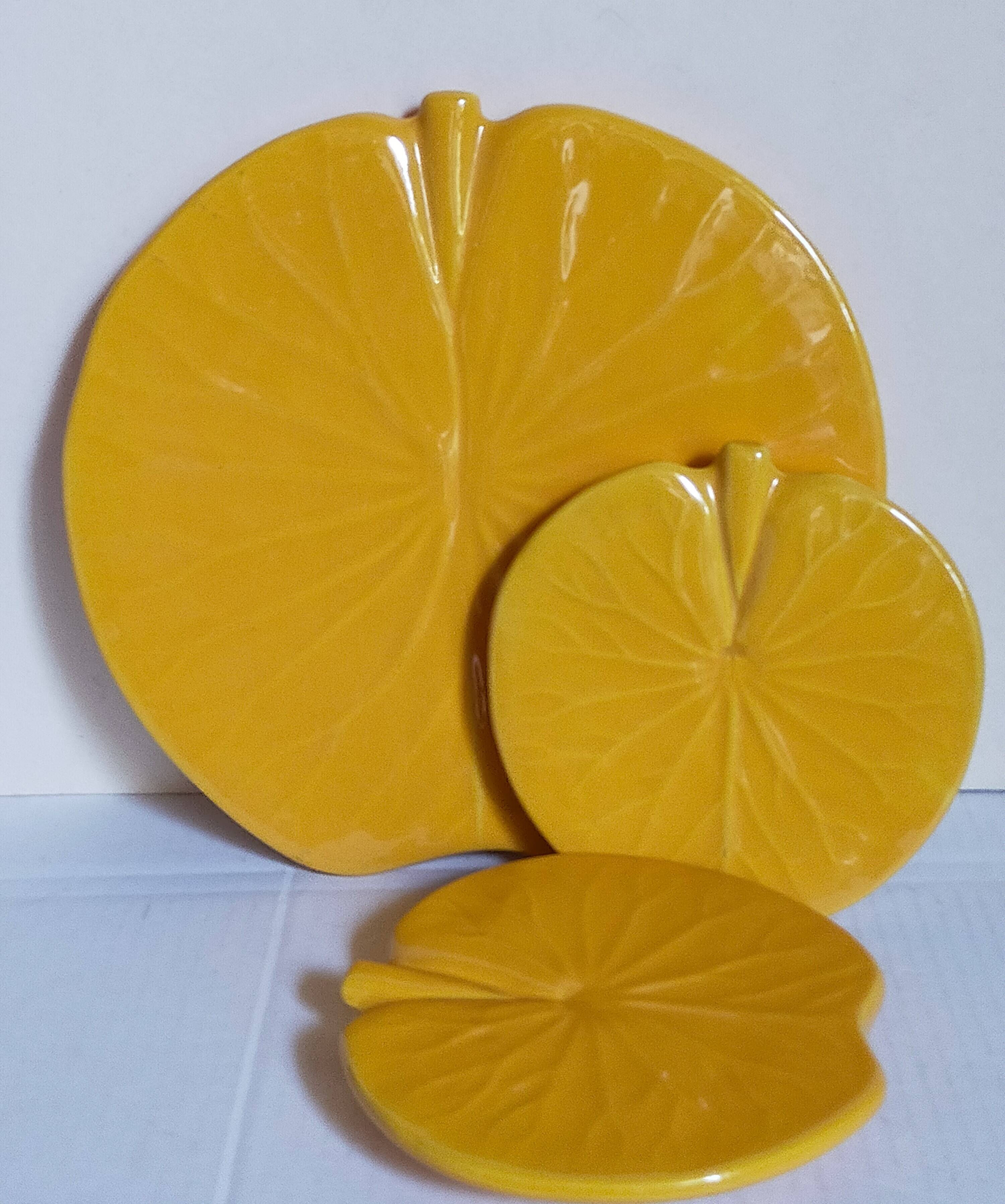 Three vintage water lily presentation dishes in slip
