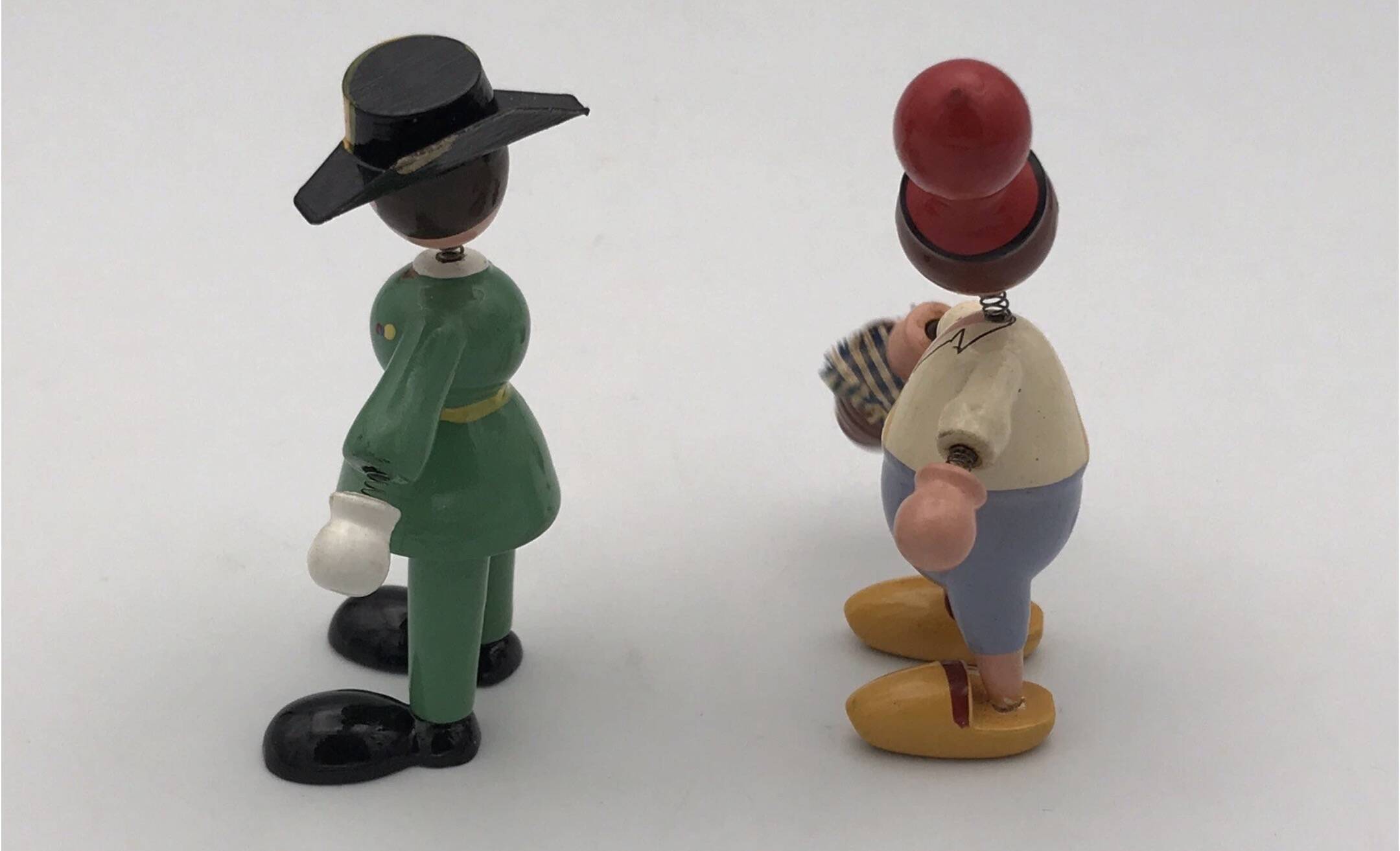 Set of 2 vintage GOULA wooden toy figurines with spring.