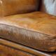Positively lived-in sheepskin leather wing chair with pleasant seating comfort