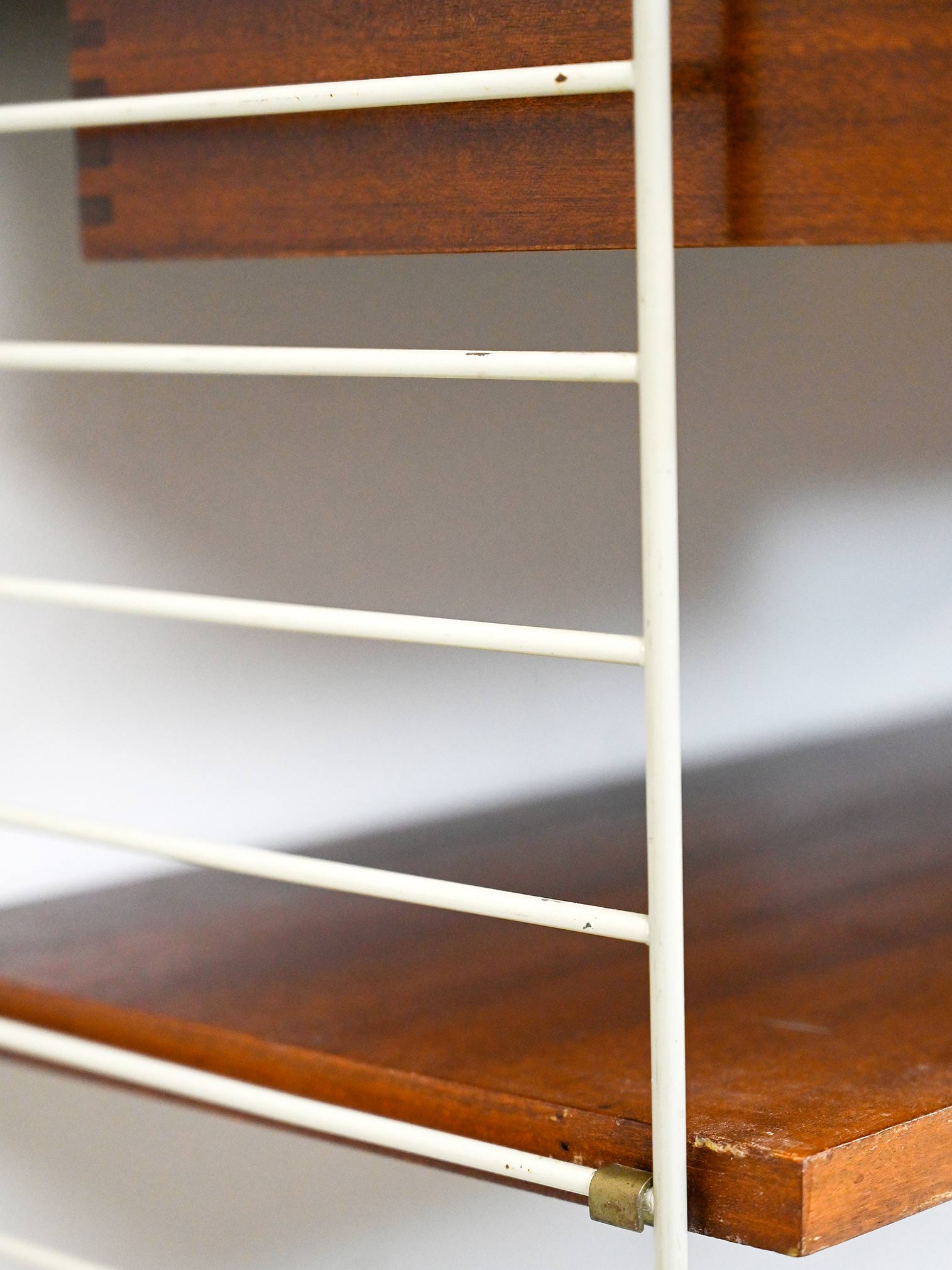 'string' bookcase with metal frame