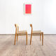 Paire de chaises de salle à manger modèle 75 par Niels O. Møller en chêne