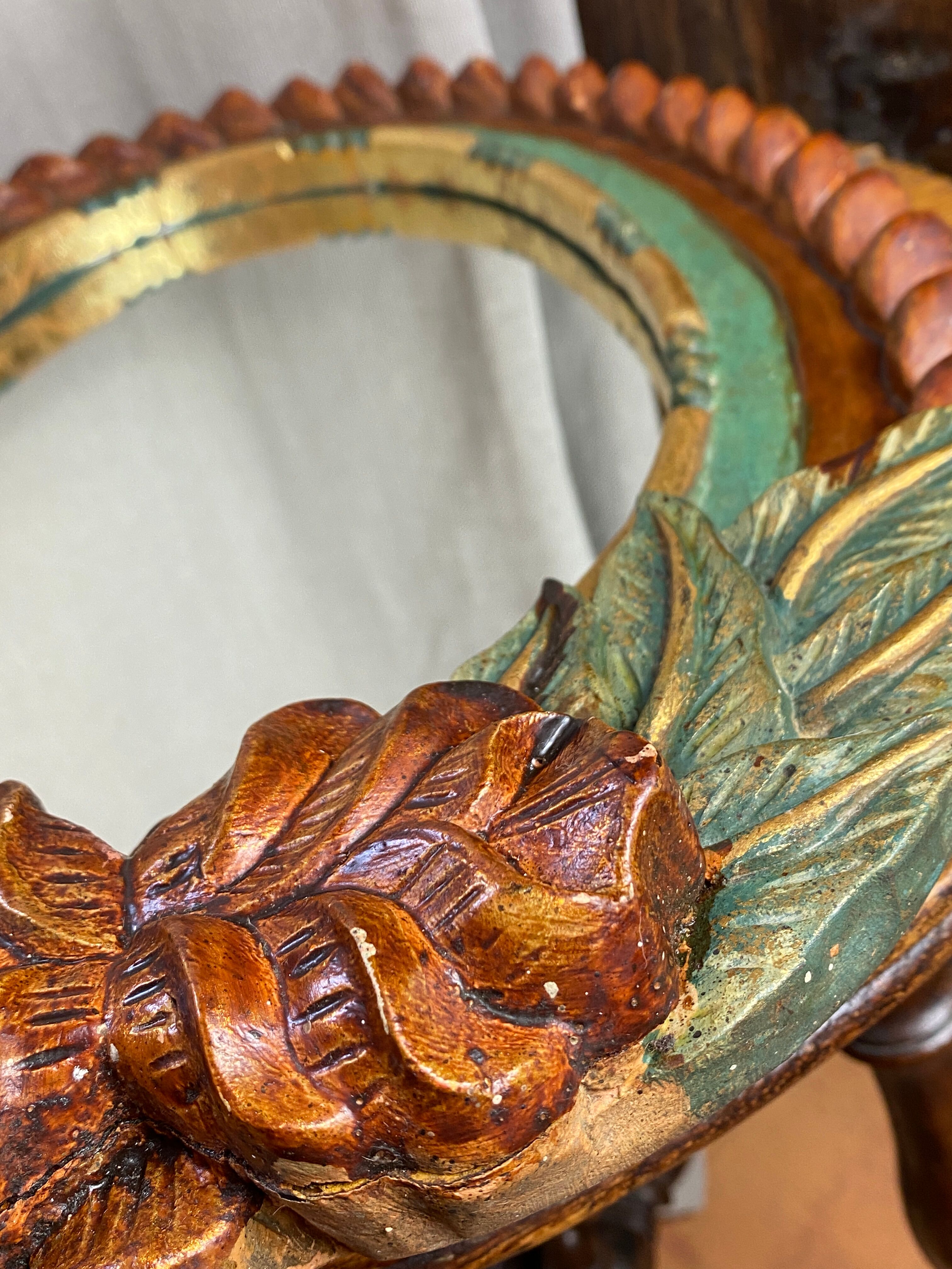 Oval mirror in carved wood