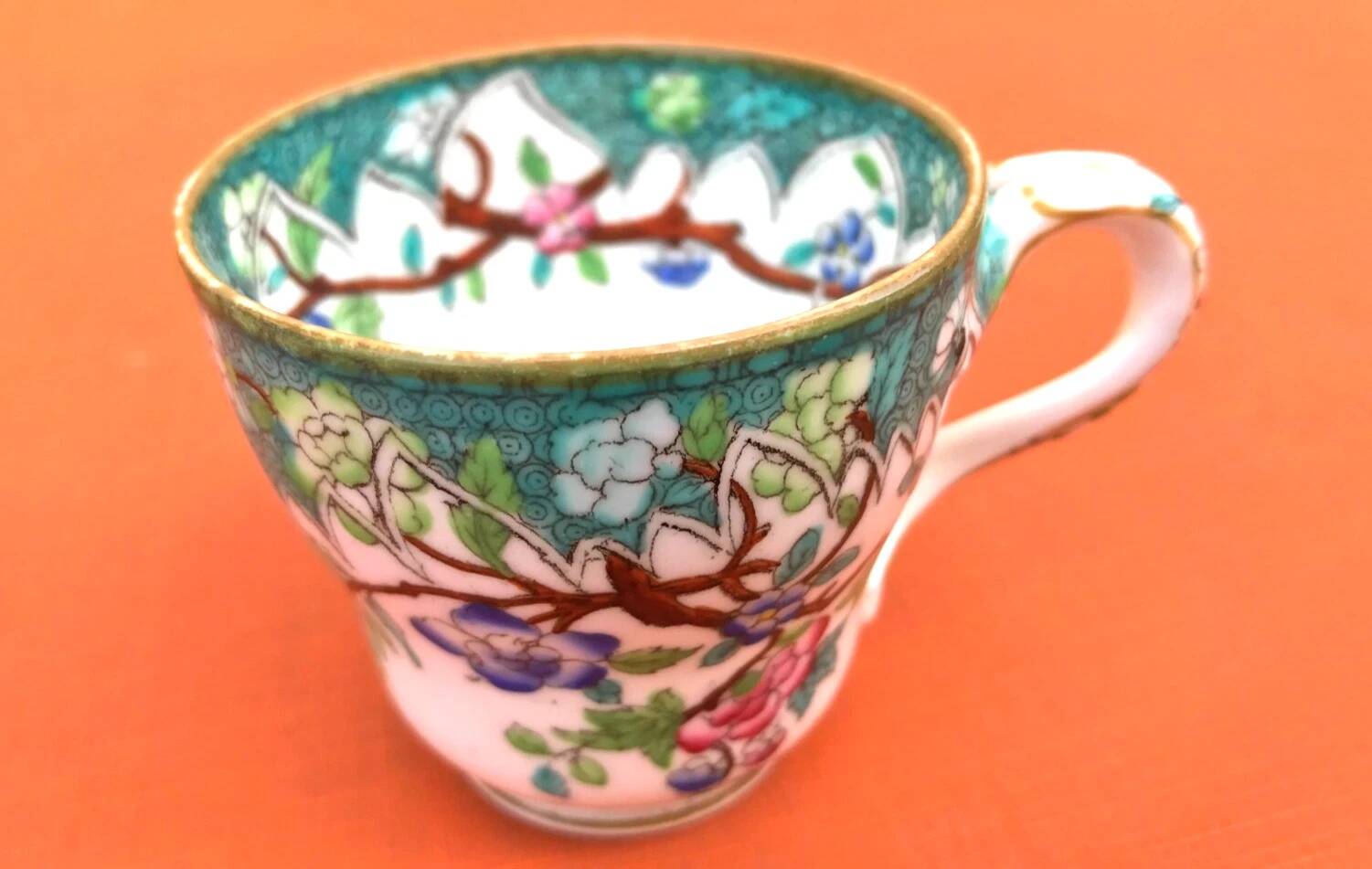 Antique porcelain cup in the Minton style with Japanese decoration.
