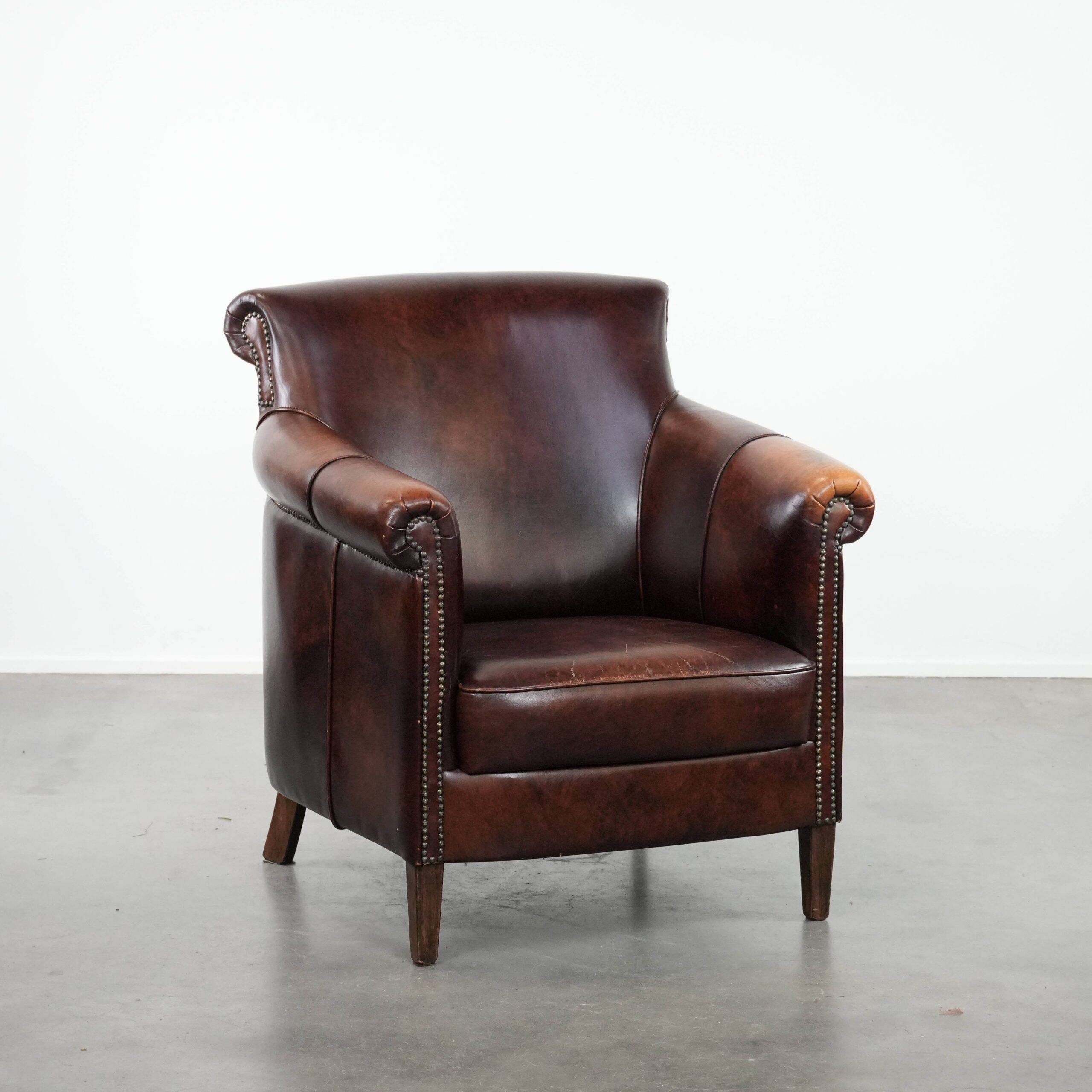 Characterful and comfortable cowhide leather armchair