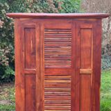 Exotic wood bar with 2 high stools.