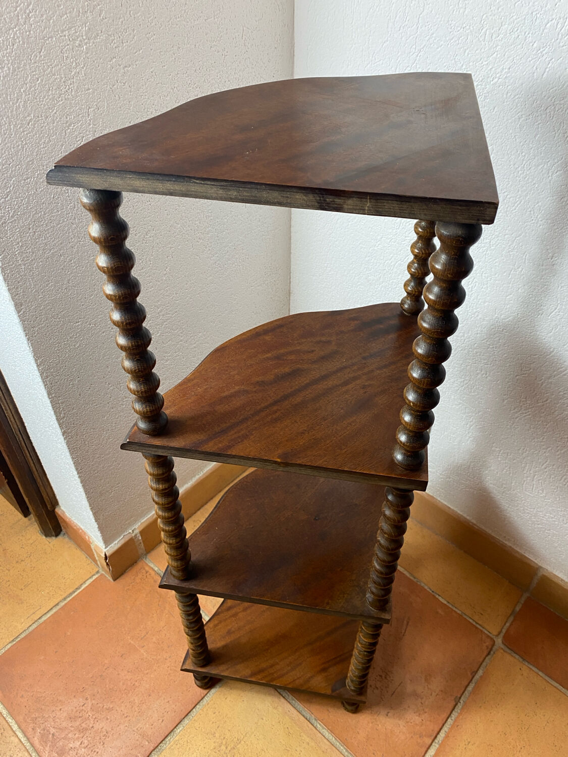 Corner shelf on a turned wooden stand