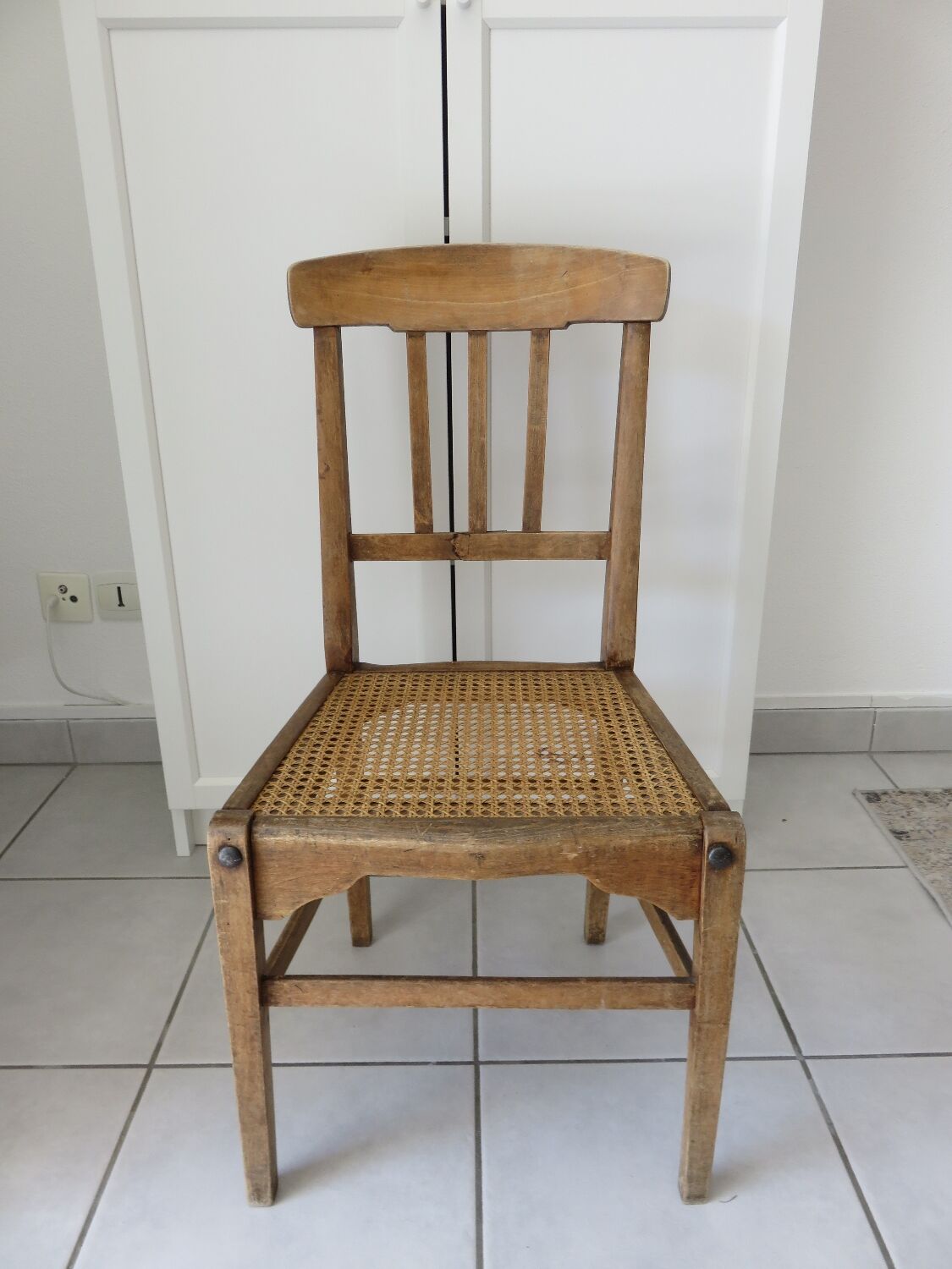 Antique solid wood chair with caning, country house style.