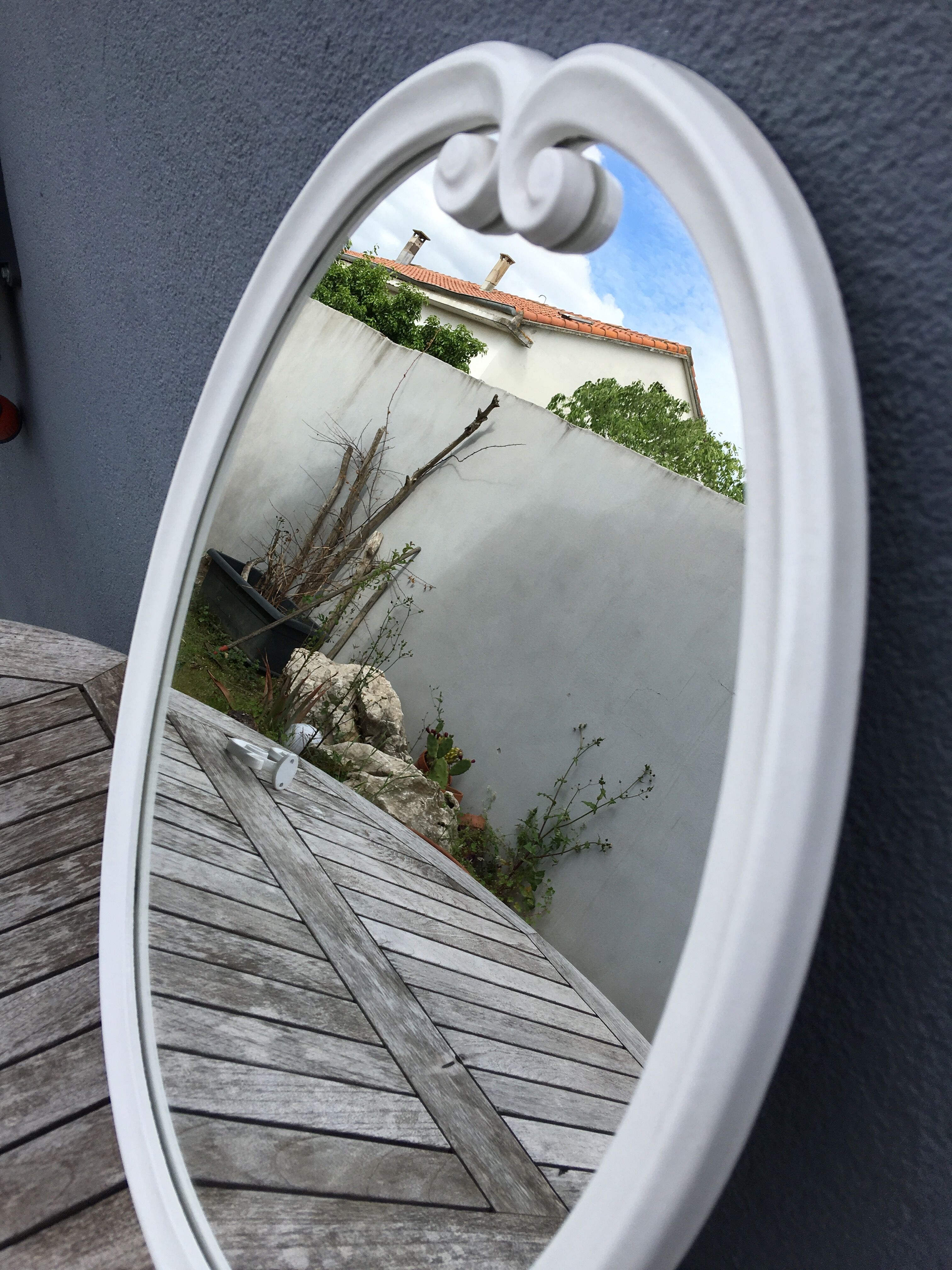 Oval mirror enamelled cast iron and its hook, circa 1950 39x49cm