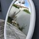 Oval mirror enamelled cast iron and its hook, circa 1950 39x49cm