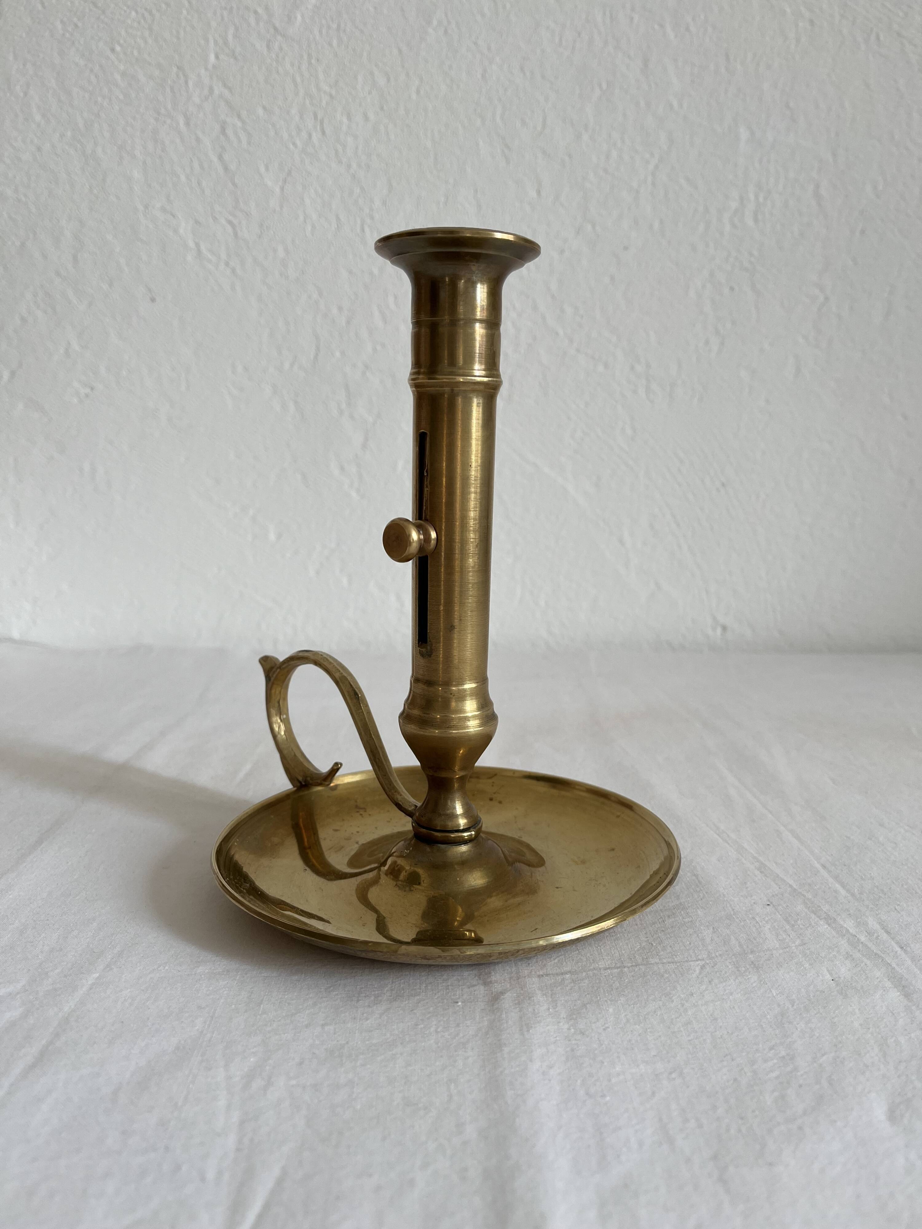 Vintage brass high hand candle holder