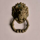 Lion door knocker, in brass