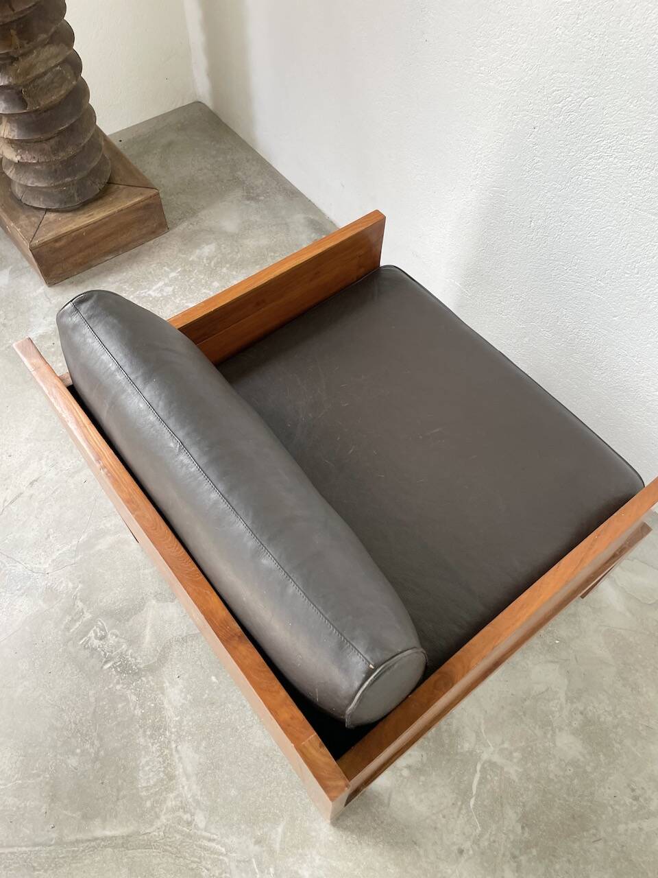 Modernist armchair in exotic wood and leather