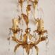 Hand-forged wall lamp gilded with gold leaf and crystals, Italy