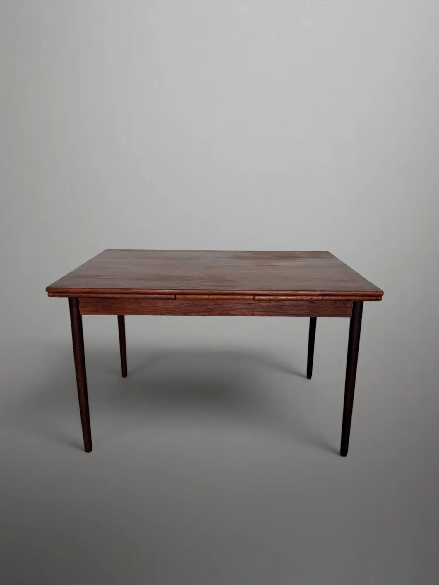 Scandinavian extendable dining table in teak