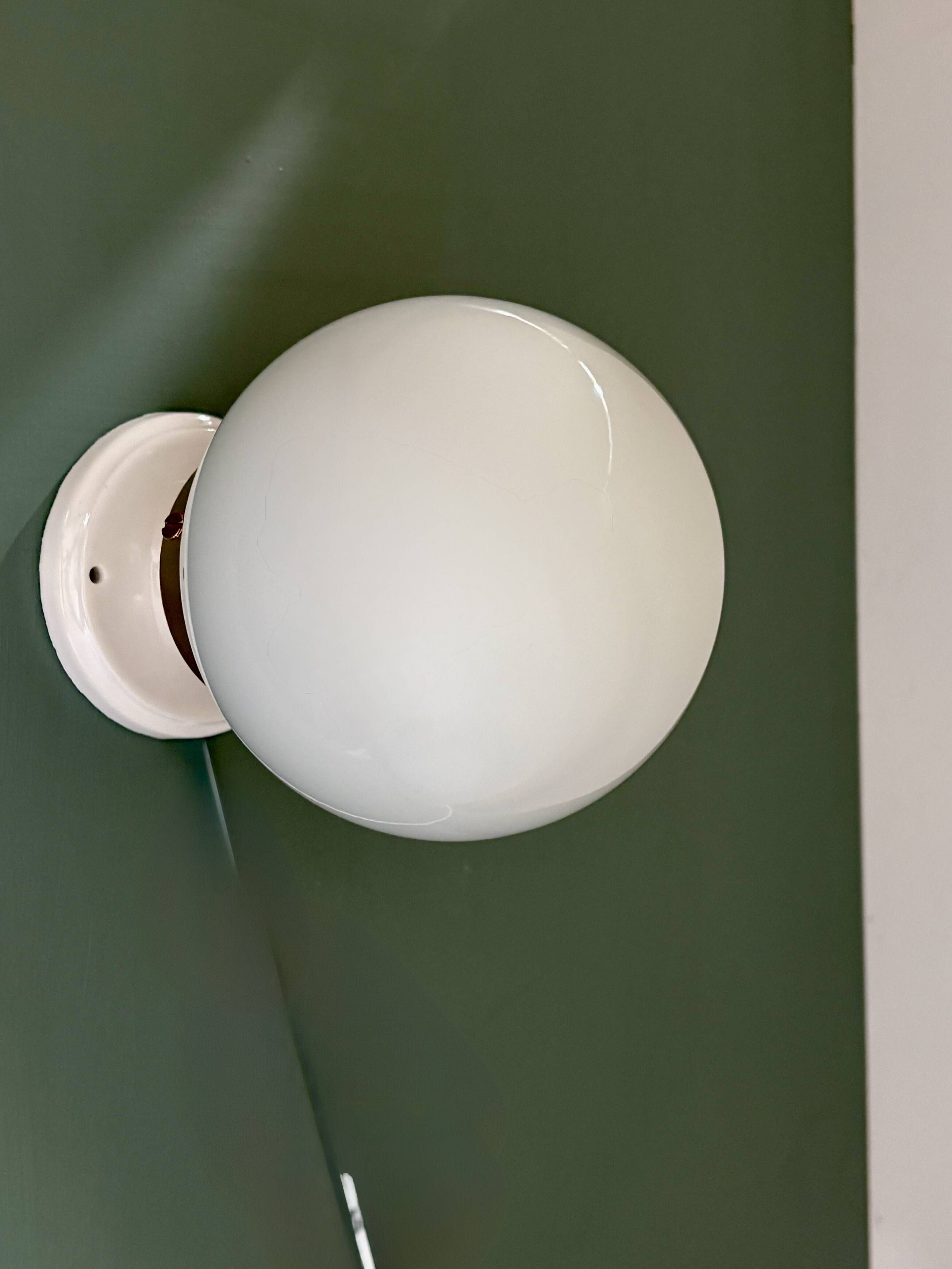 Vintage globe wall or ceiling light in white opaline.