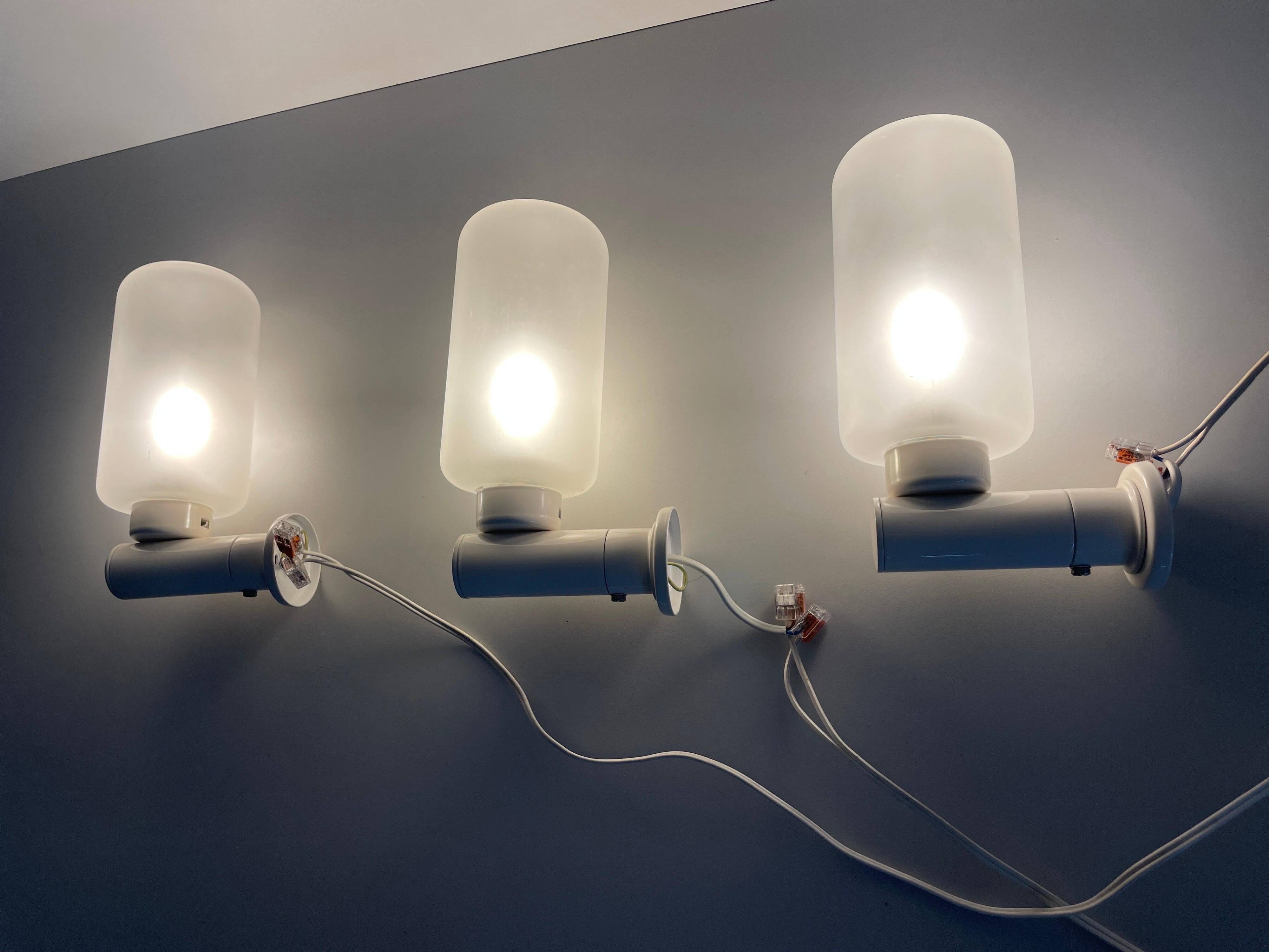 Set of 3 semi-transparent glass and white metal wall lights, 1960, Germany