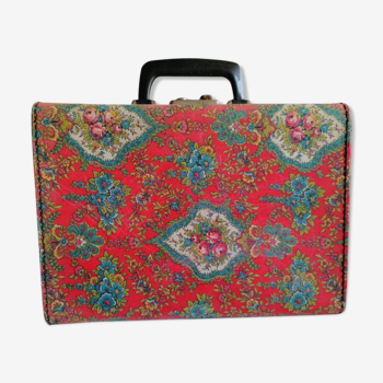 Old suitcase, red cashmere fabric, bohemian folk