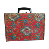 Old suitcase, red cashmere fabric, bohemian folk