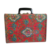 Old suitcase, red cashmere fabric, bohemian folk
