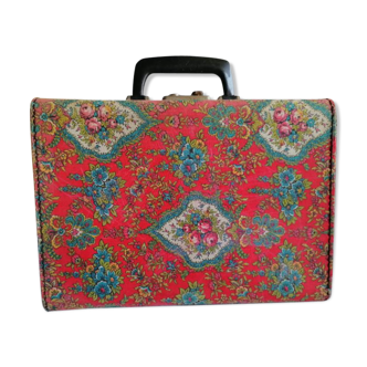 Old suitcase, red cashmere fabric, bohemian folk